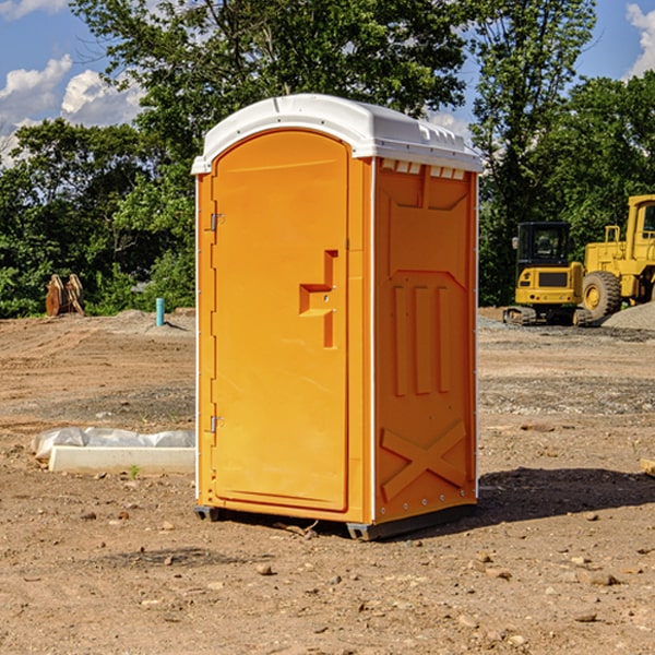 what is the cost difference between standard and deluxe portable restroom rentals in Cassia County